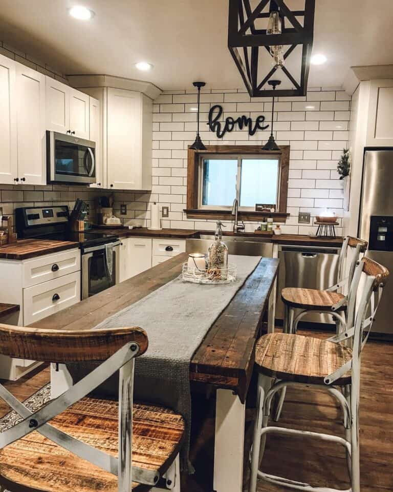 White Subway Tile Kitchen With Wood Island