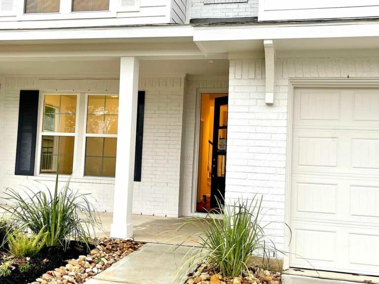 White Painted Brick House With Black Door