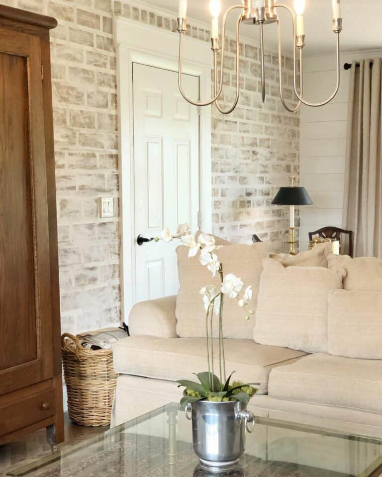 Living Room With Whitewashed Brick Accent Wall