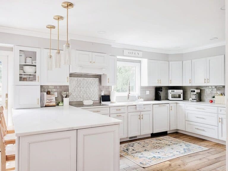 Glass Pendants Over U Shaped Kitchen Peninsula