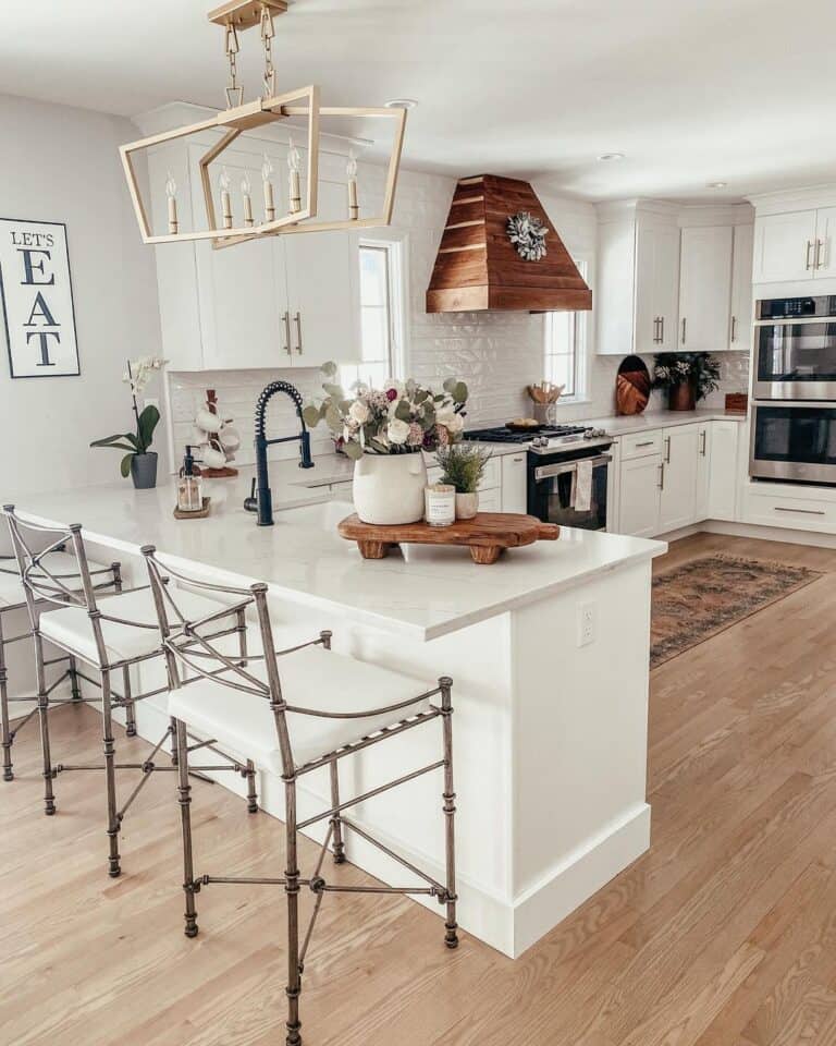 Gold Pendant Lamp Over a U Shaped Kitchen Peninsula
