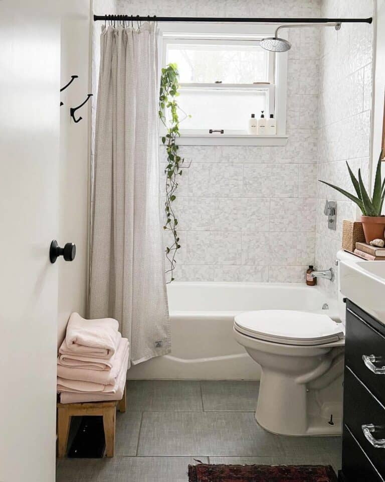 Gray Floor Tiles Around Bathtub