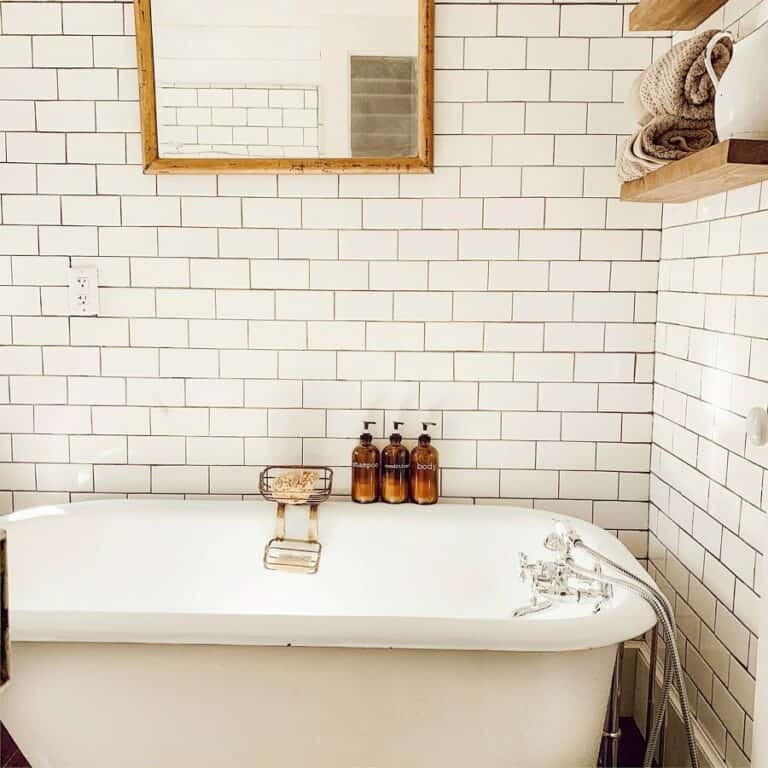Bright Farmhouse Bath With a Freestanding Tub