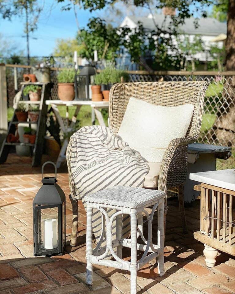 Wicker Furniture Arranged on Brick Patio