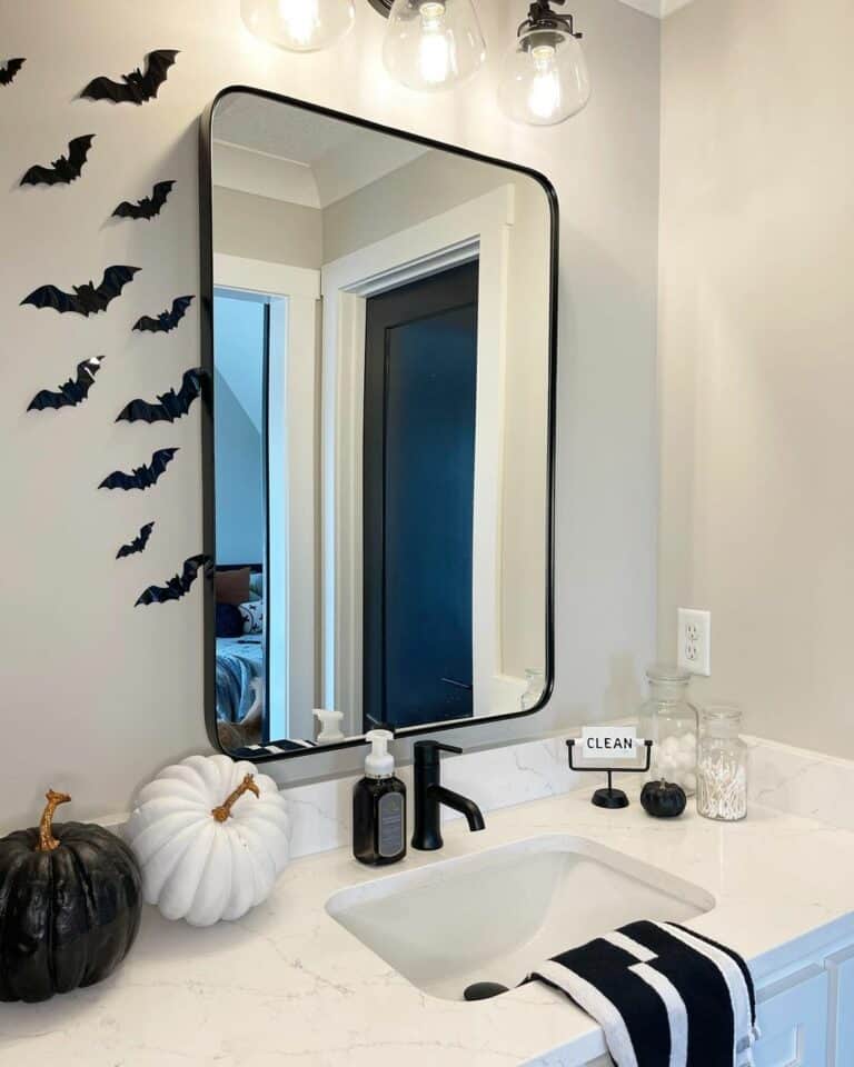 White Sink Area With Festive Black Decorations