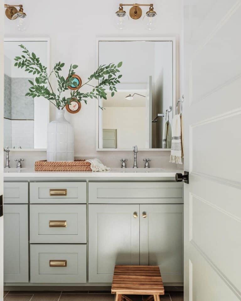 Light Blue Gray Double Vanity with Gold Fixtures
