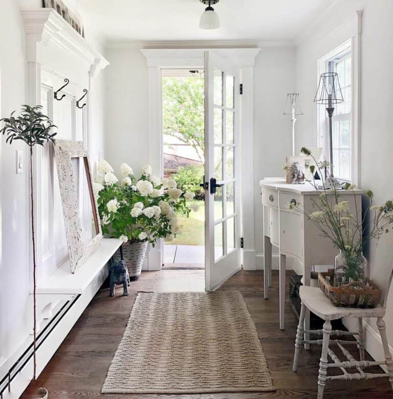 White Flowers in Pristine White Entryway