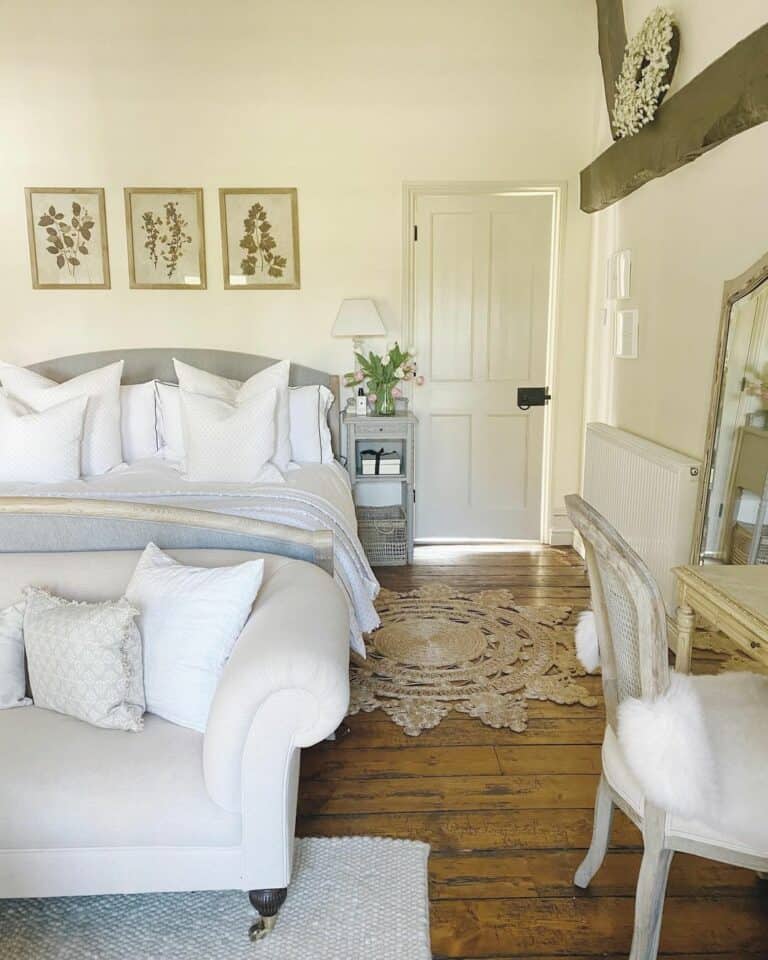 Gray Bed Against a Wall in a Narrow Bedroom