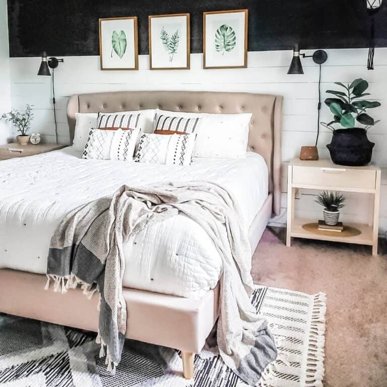 Bed Against a Shiplap Wall With Reading Lights