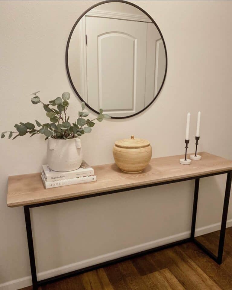 Simple Entryway With Wood Table and Metal Accents
