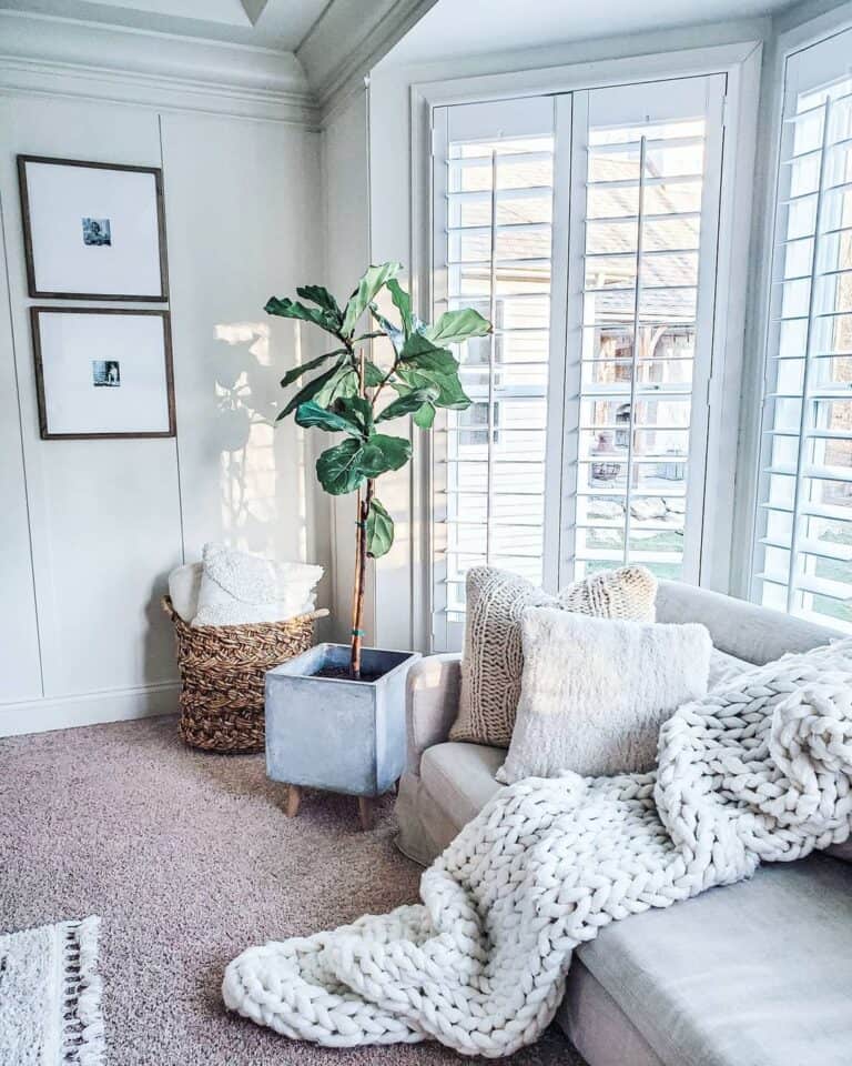 Bay Windows Behind White Farmhouse Sofa