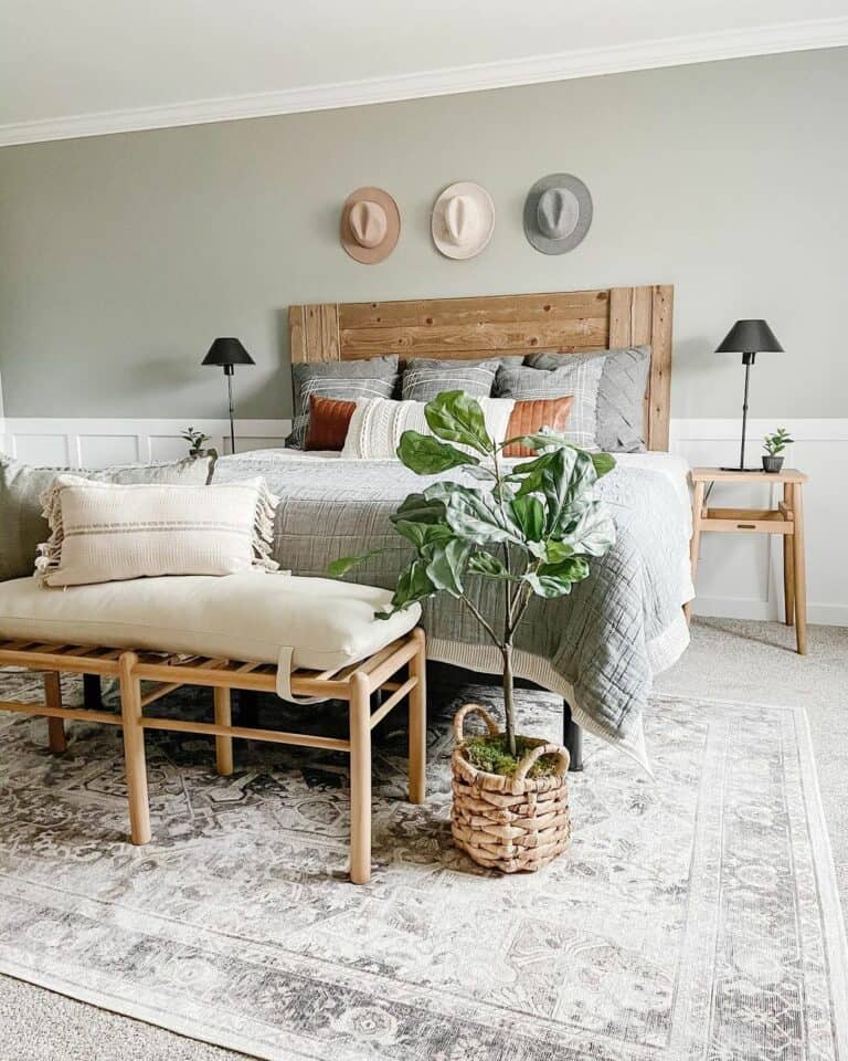Hats on a Light Gray Wall With White Wainscoting