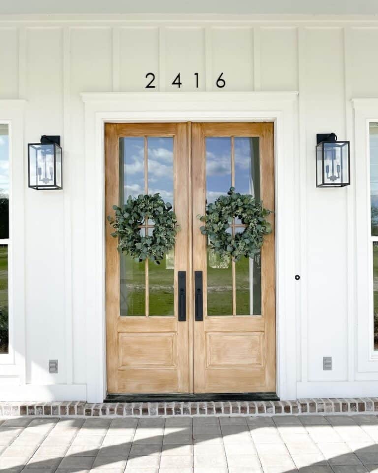 Black Lantern Sconces and Wood Front Doors