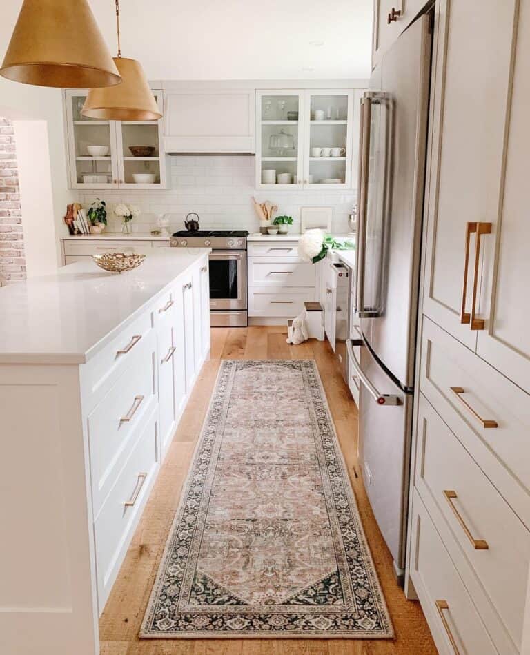 Black and Beige Kitchen Runner Between an Island and Refrigerator