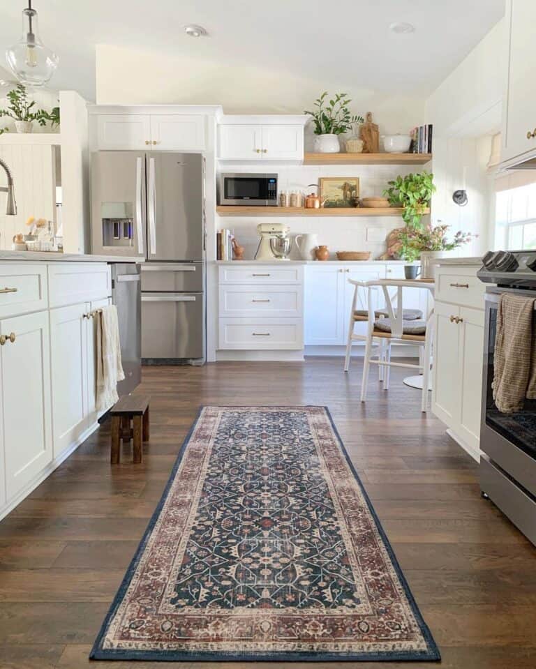 Black and Brown Kitchen Runner Next to a Wooden Stool