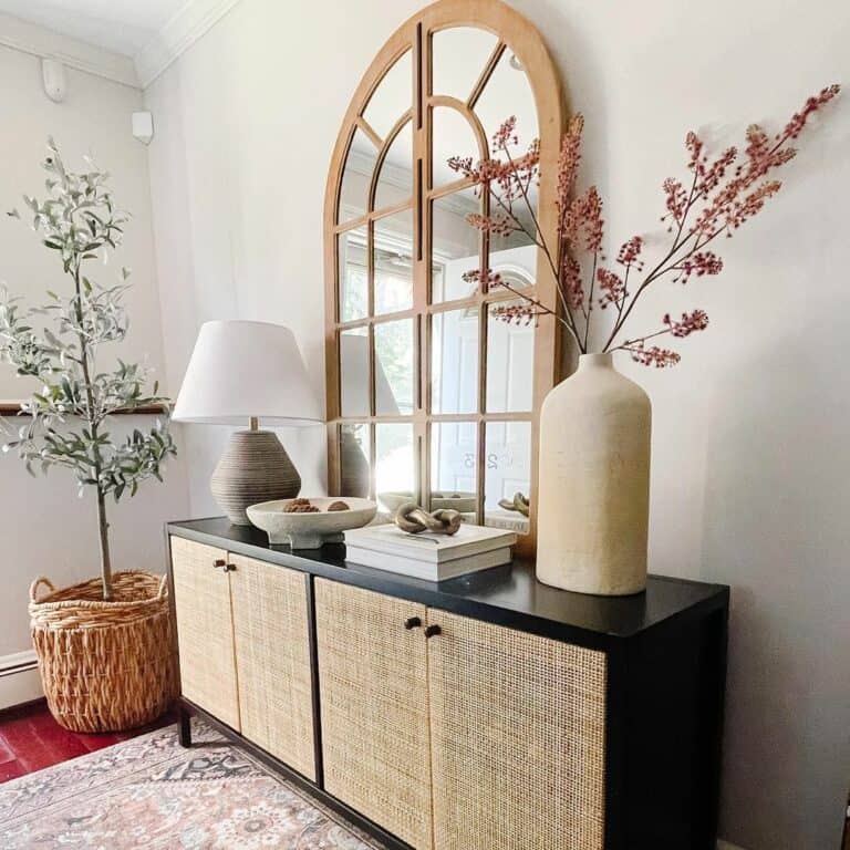 Warm Neutral Entryway With Arched Mirror