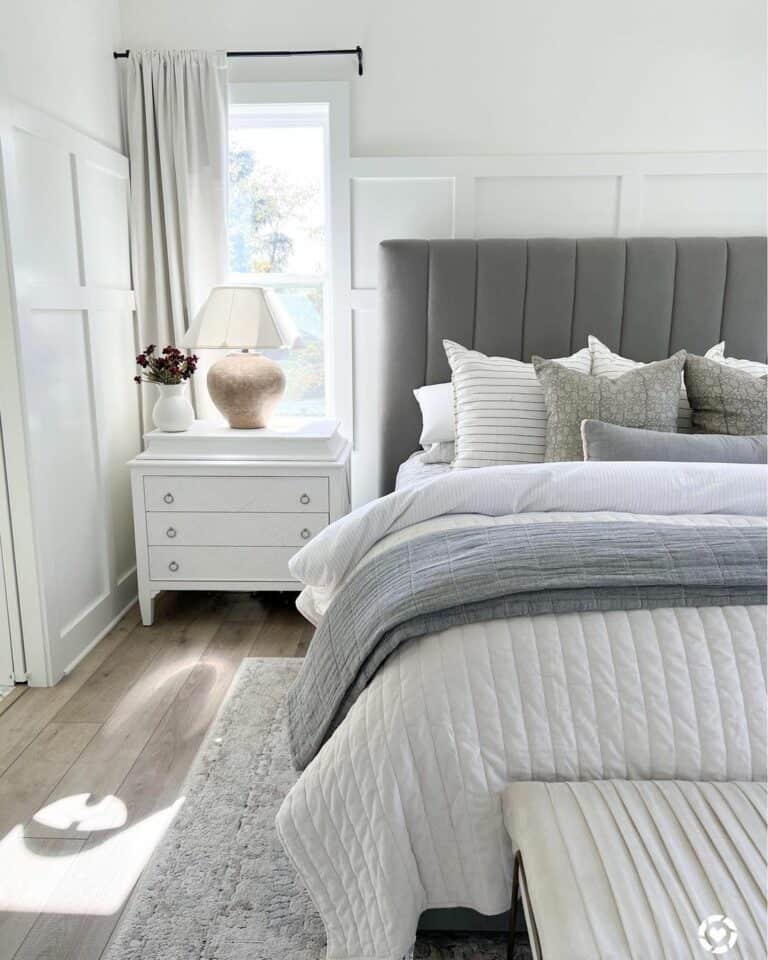 Large Gold Lamp on a White Nightstand