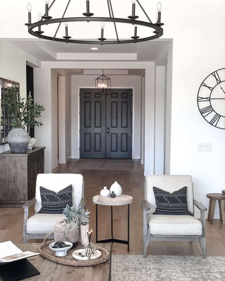 Brown Rug in Front of Black 6-Panel Front Doors