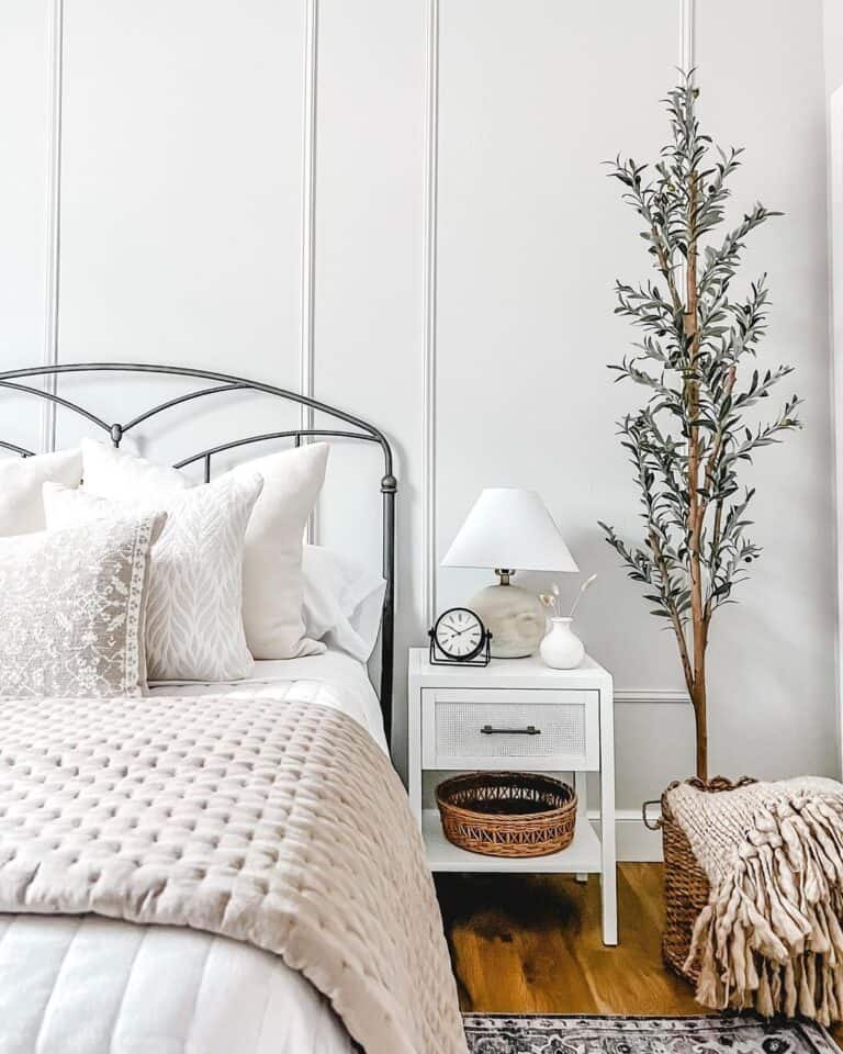 White Accent Wall and Faux Olive Tree
