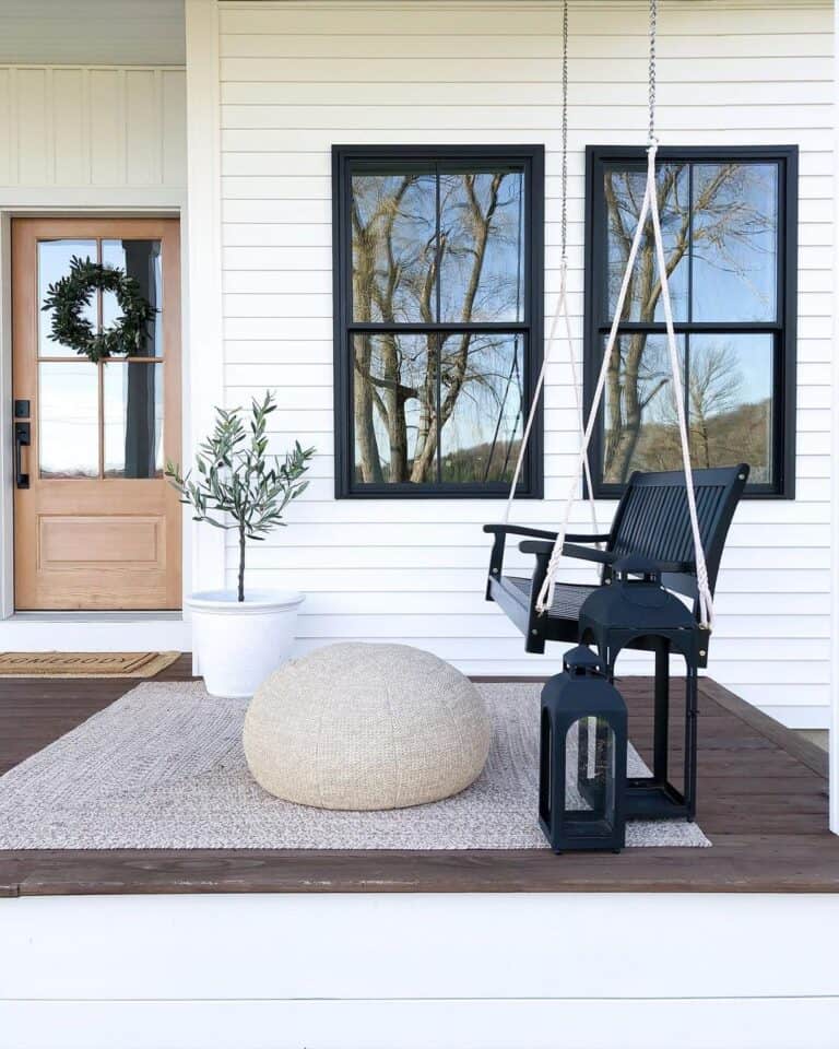 Porch Sitting Area with Swing and Lanterns