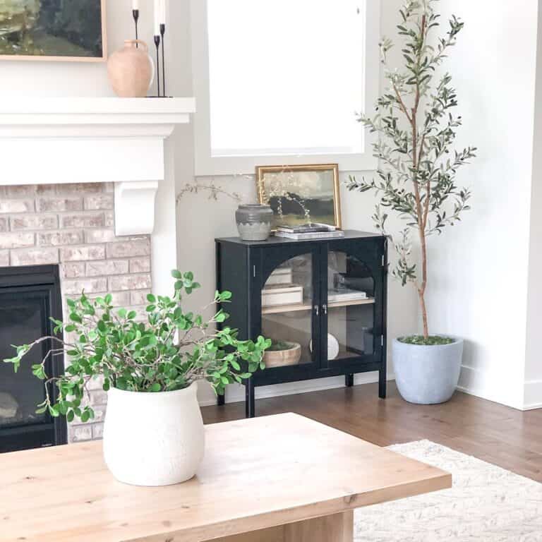 Brick Fireplace and Arched Glass Cabinet