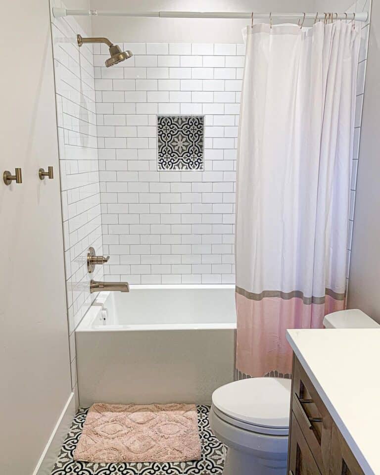 Alcove Bathtub Paired with Pink Accessories