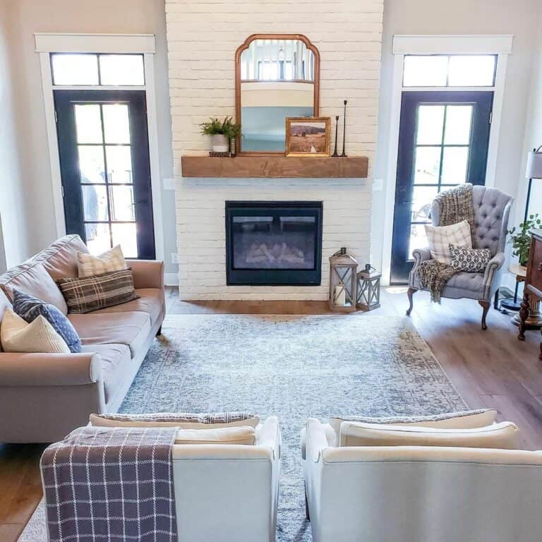 Cozy Cottage-style Living Room With White Brick Fireplace