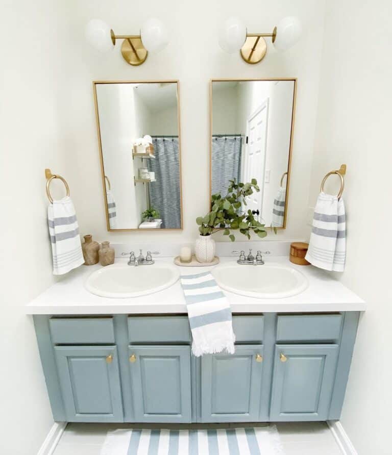 Brass Accessories Around Blue Double Vanity