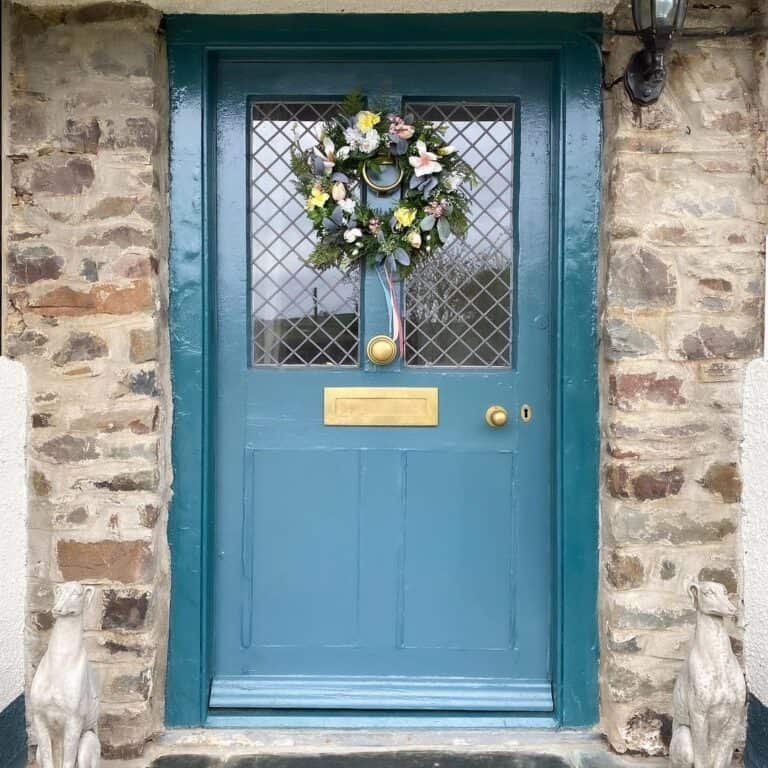 Bright Brass Hardware on Blue Door