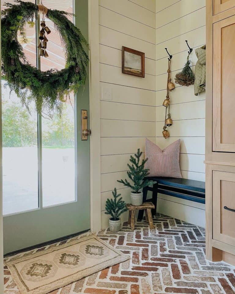 Light Green Front Door With Brass Doorknob