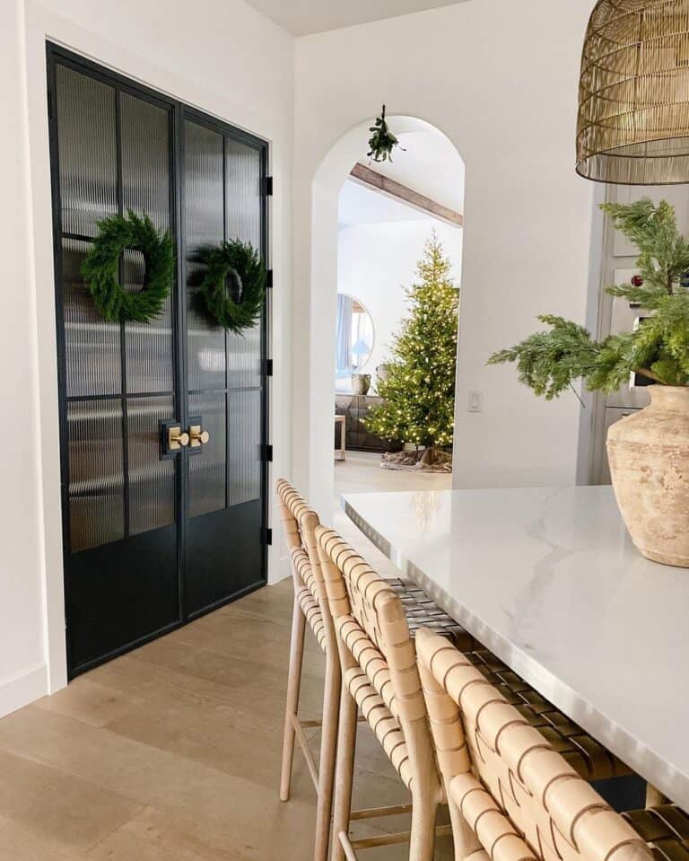 Kitchen with Double Black French Doors and Satin Brass Knobs