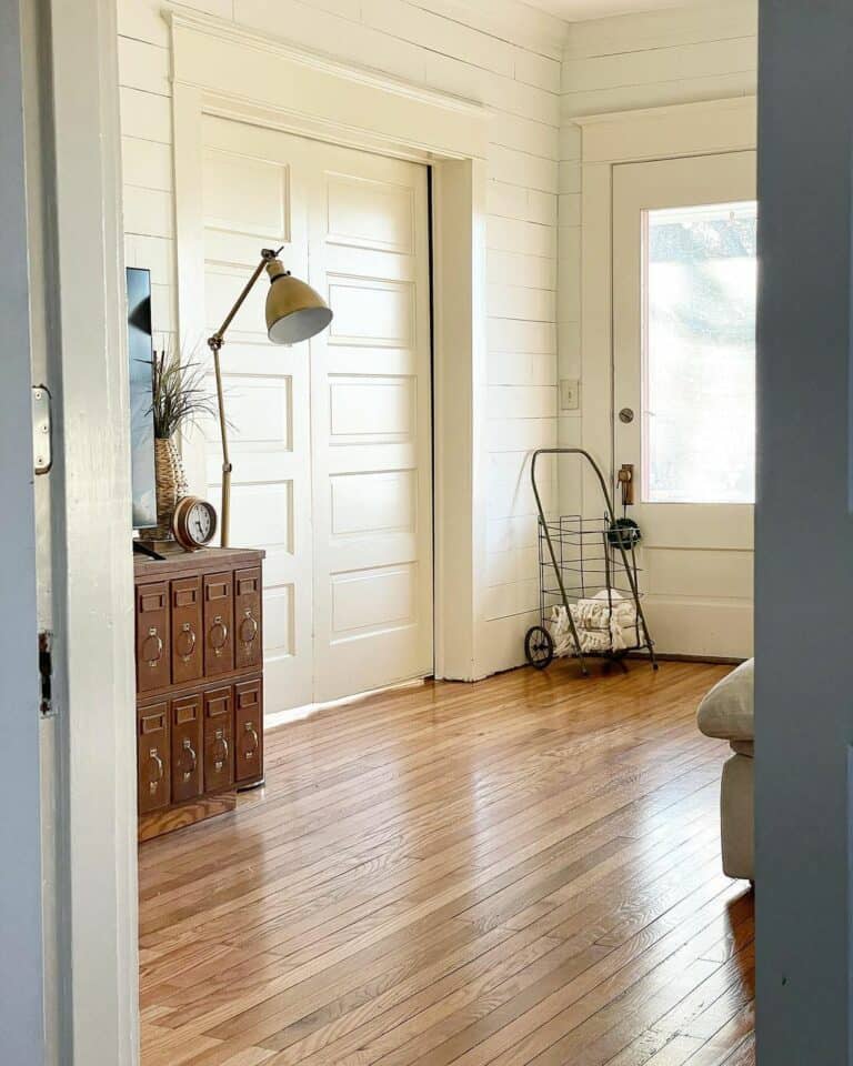 Vintage Living Room With Paneled Pocket Doors