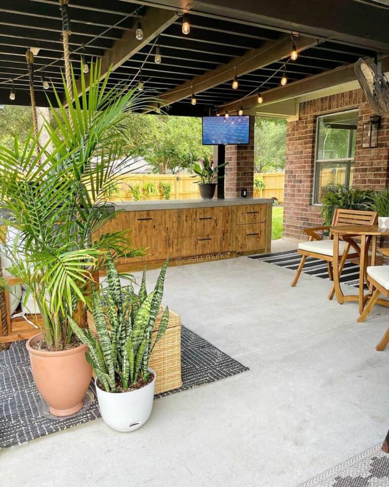 Pergola With String Lights Above Outdoor Bar