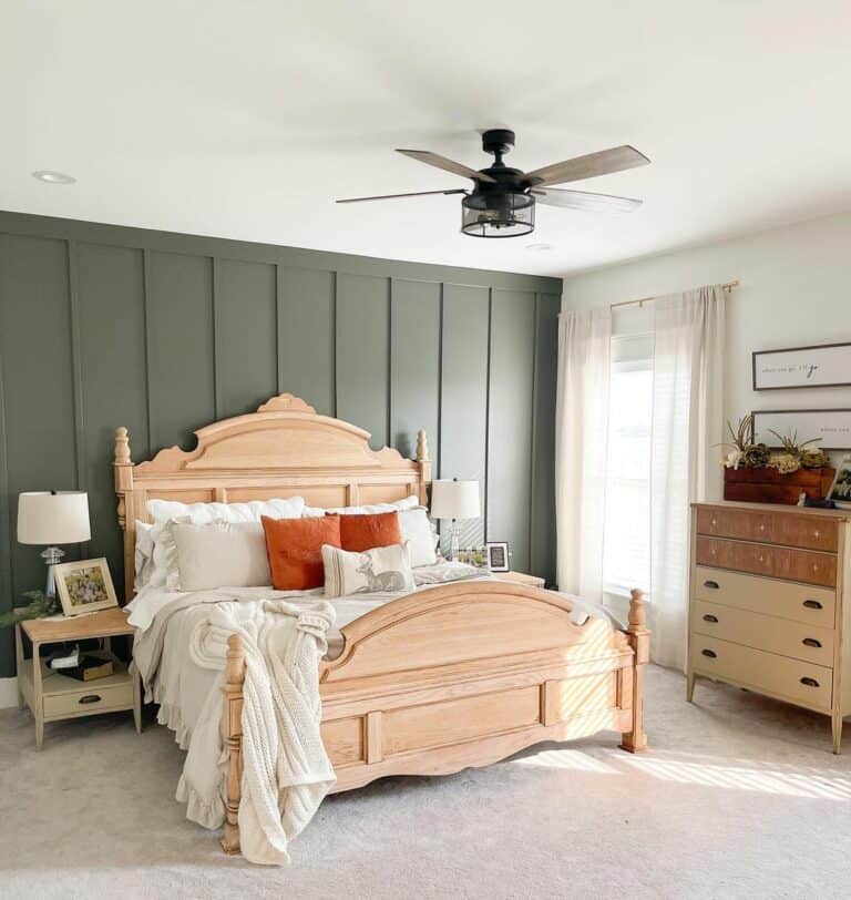 Elaborate Bed Frame Topped With Orange Pillows