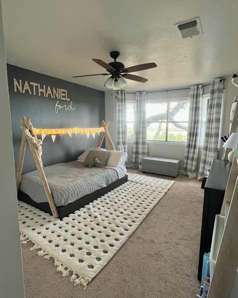 Black Accent Wall With Canopy in Toddler Room