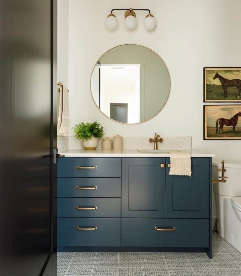 Dark Blue Vanity on Gray Tile Flooring