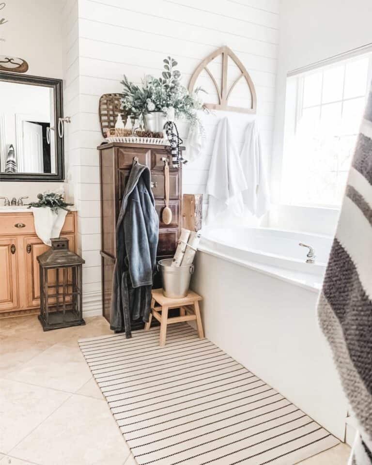 Well-Lit Bathroom with Wooden Dresser