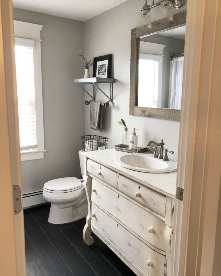 Black Tile Floor Bathroom with Rustic Vanity