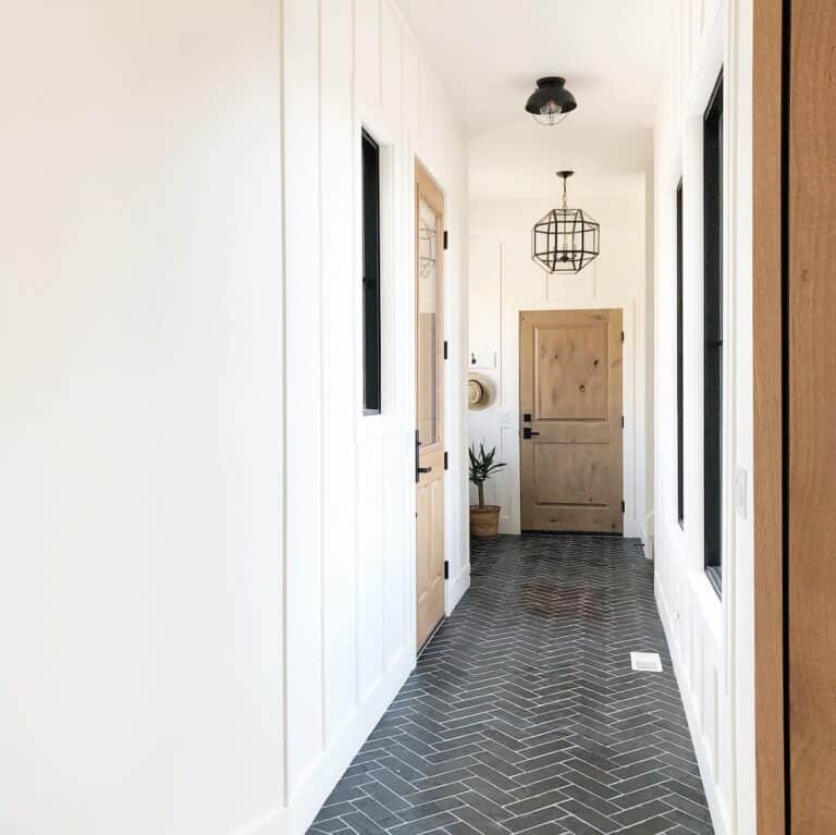 Entryway Lighting Above Black Herringbone Floor