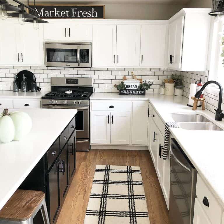 White Farmhouse Kitchen With Black Contrasting Island