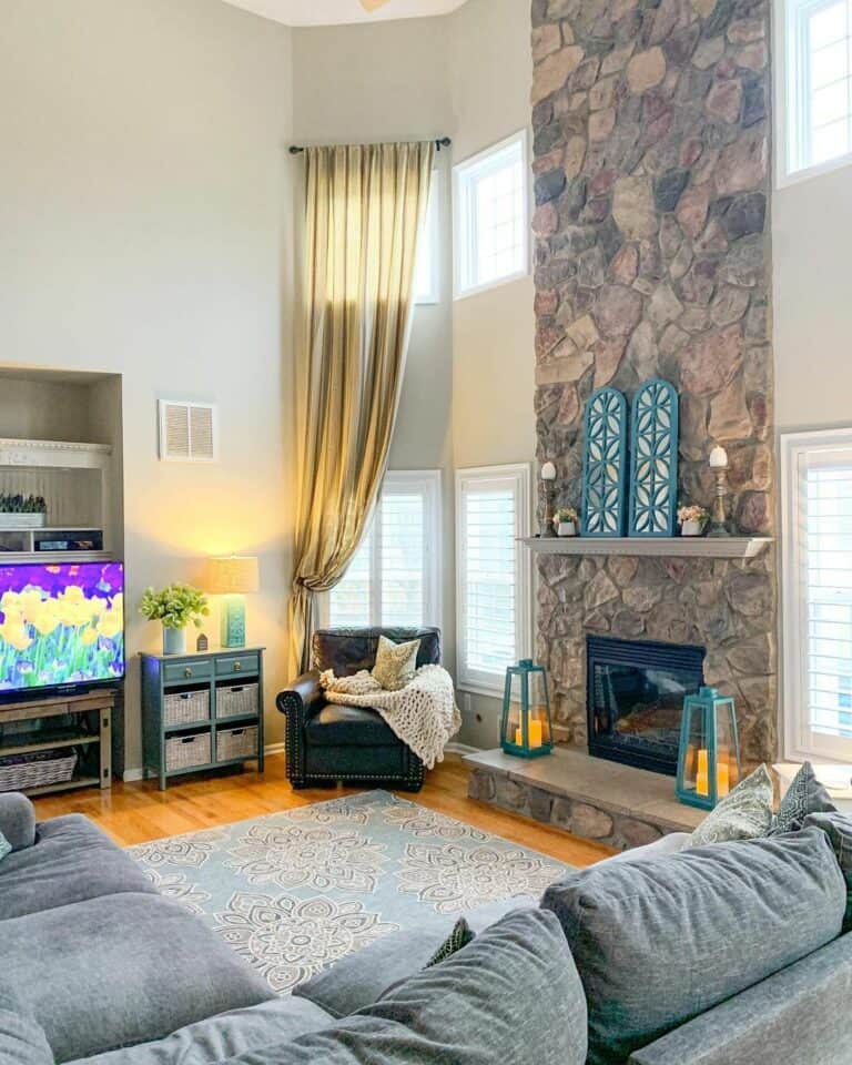 Luxurious Family Room With Floor-to-Ceiling Stone Fireplace