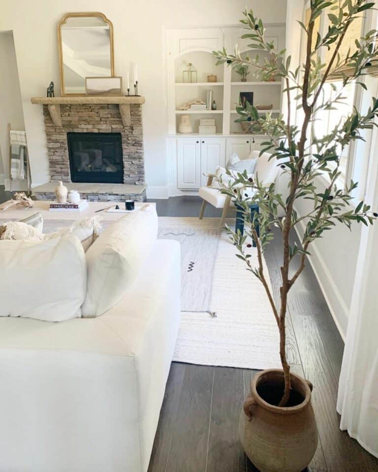Pristine Living Room With Stone Fireplace