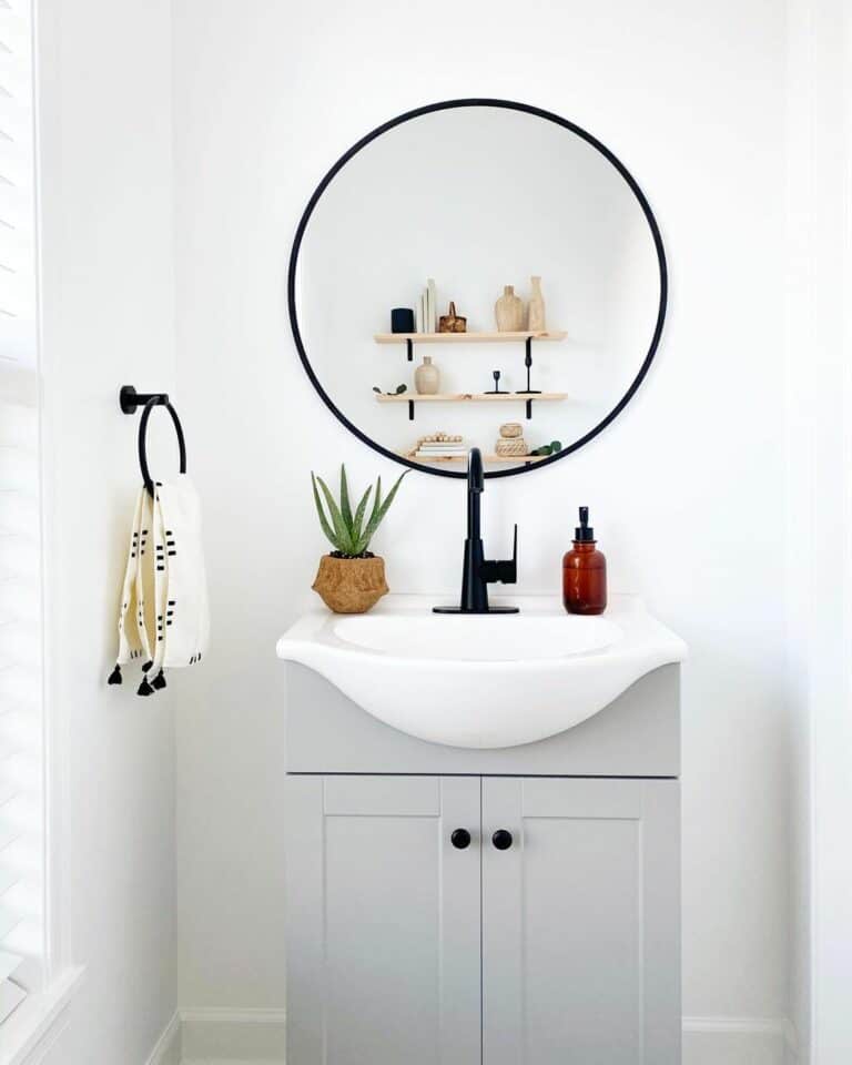 Gray Washstand With Black Circular Mirror