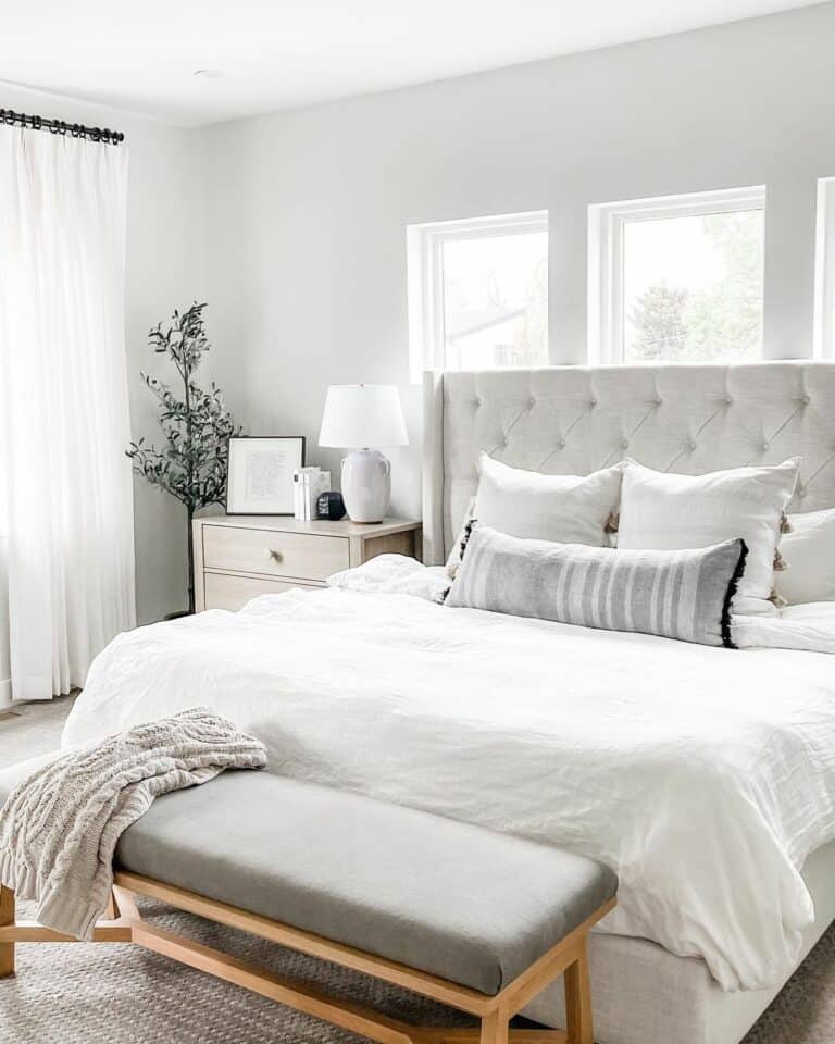Tufted Headboard in Front of Windows