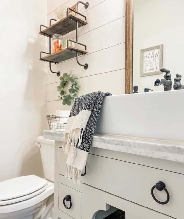 Soft Grey Accents in a White Farmhouse Bathroom
