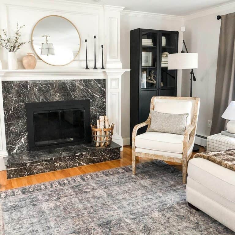 Black Marble Fireplace With a Vintage Steel Firewood Basket