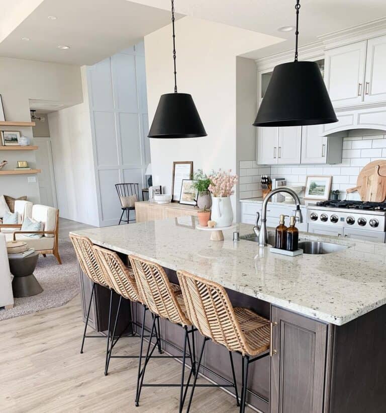 Black Shaded Pendants Over Wicker Island Chairs