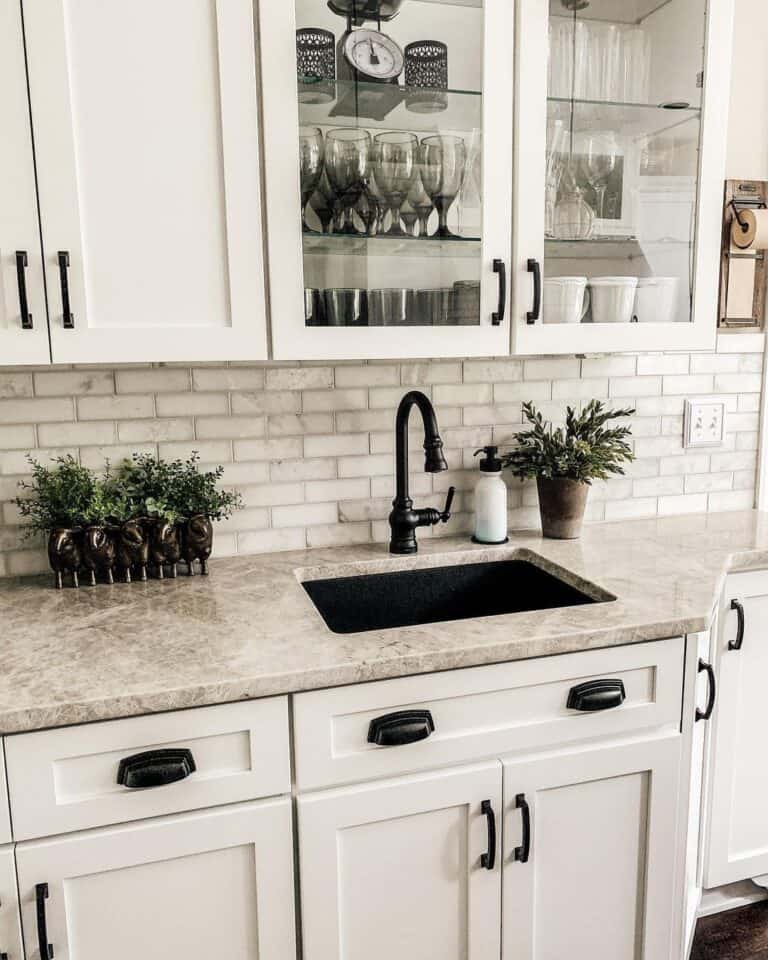 Black Faucet and Pulls with a Light Brown Countertop