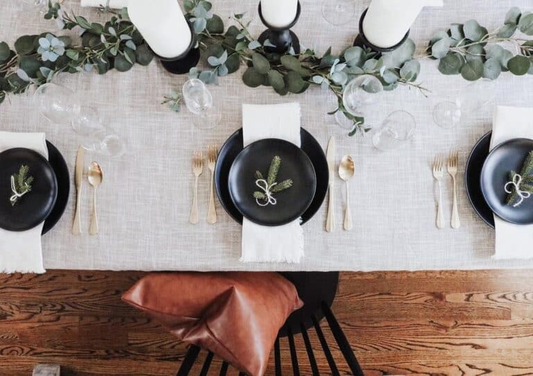 Black and White Table Setting and White Candles on Black Candlesticks