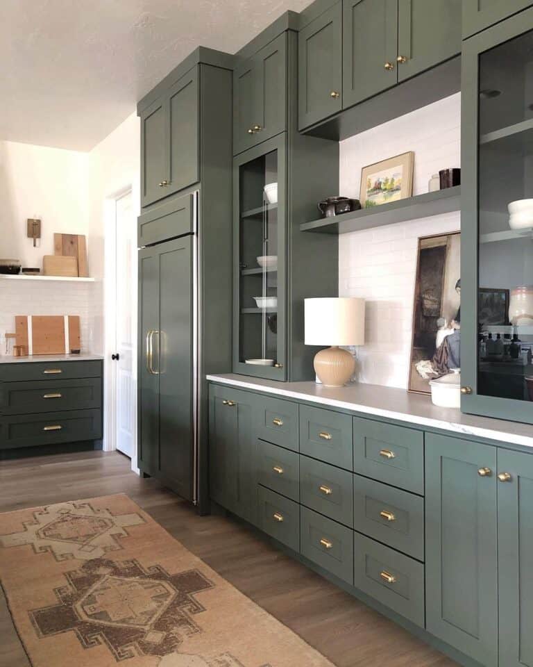 Green Kitchen Cabinets with Gold Cup Drawer Pulls and Knobs